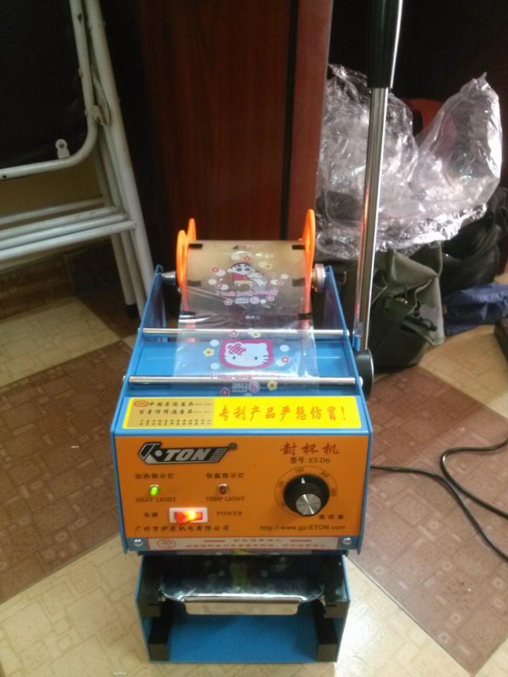 Máy dán miệng ly sữa chua Máy dán miệng ly sữa chua